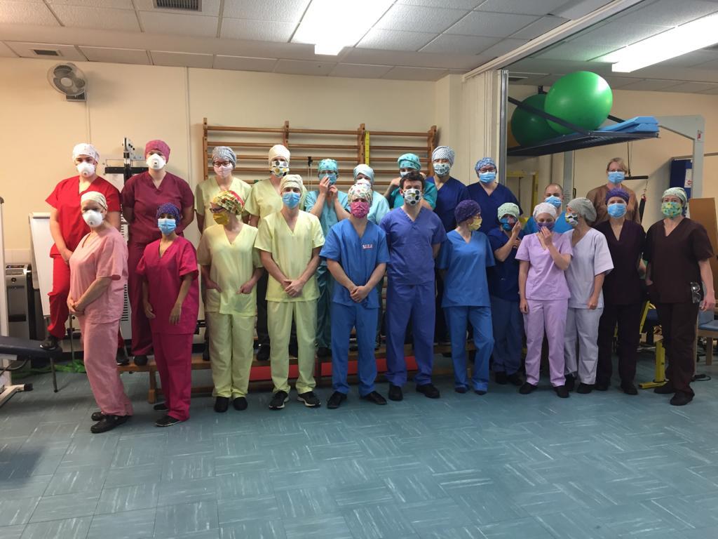 Physiotherapists and nurses in the Princess of Wales hospital wearing our scrub hats